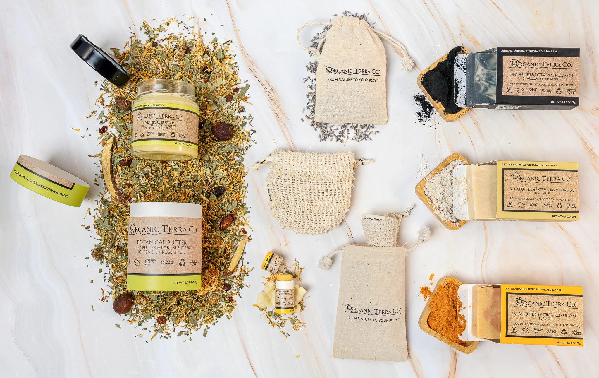 Organic Terra Co. Signature Gift Collection contents — charcoal, unscented and turmeric botanical soaps with 6.4 oz Botanical Butter and lip balm