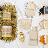 Organic Terra Co. Signature Gift Collection contents — charcoal, unscented and turmeric botanical soaps with 6.4 oz Botanical Butter and lip balm