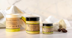 Organic Terra Co. Botanical Butter — Shea & Kokum, shown in three sizes with raw shea butter on white marble.