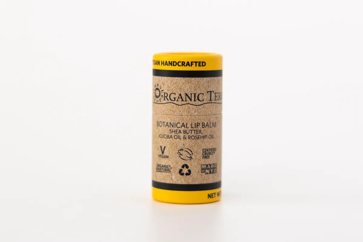 ORGANIC TERRA CO.® Botanical Lip Balm single tube front label showing vegan certified cruelty free and Made in NYC certifications on white background

