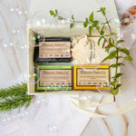 Organic Terra Co. Botanical Cleansing Trio in an open gift box with three handcrafted botanical soap bars