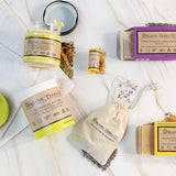 Organic Terra Co. Daily Collection contents — two botanical soap bars, 6.4 oz Botanical Butter, botanical lip balm and dried-lavender sachet