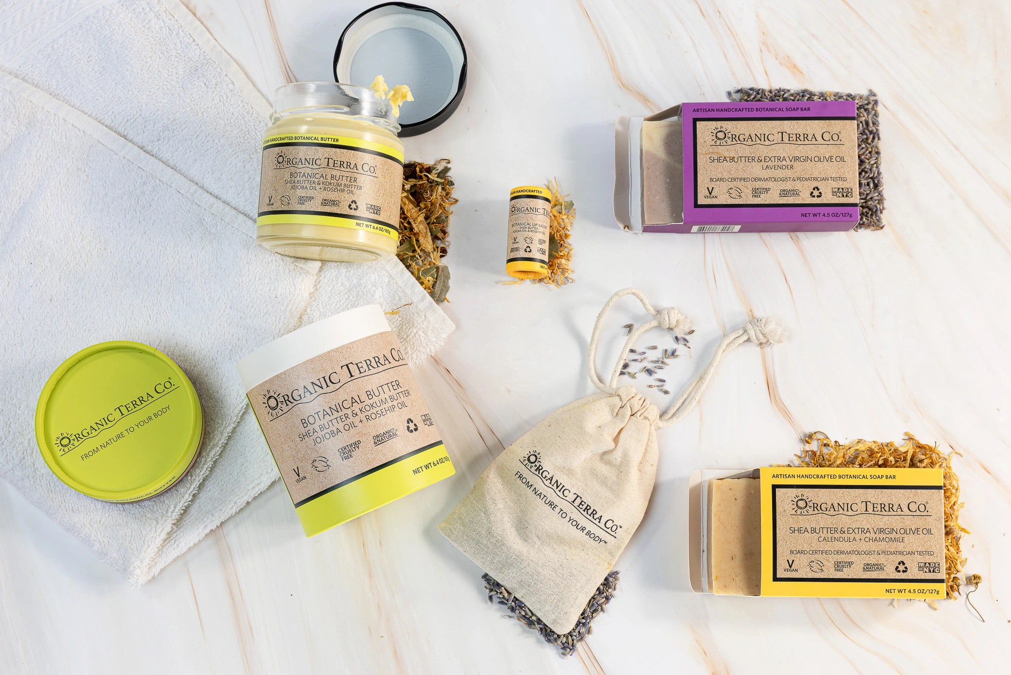Organic Terra Co. Daily Collection contents — two botanical soap bars, 6.4 oz Botanical Butter, botanical lip balm and dried-lavender sachet