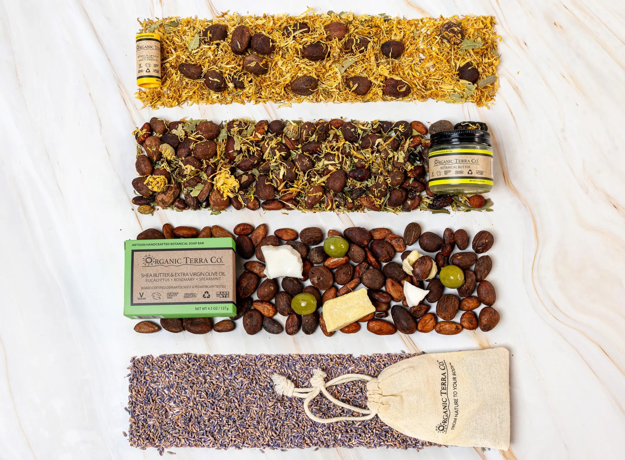 Organic Terra Co. Discovery Collection contents — botanical soap bar, 2.4 oz Botanical Butter, lip balm and dried-lavender sachet with the botanicals inside each