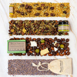 Organic Terra Co. Discovery Collection contents — botanical soap bar, 2.4 oz Botanical Butter, lip balm and dried-lavender sachet with the botanicals inside each