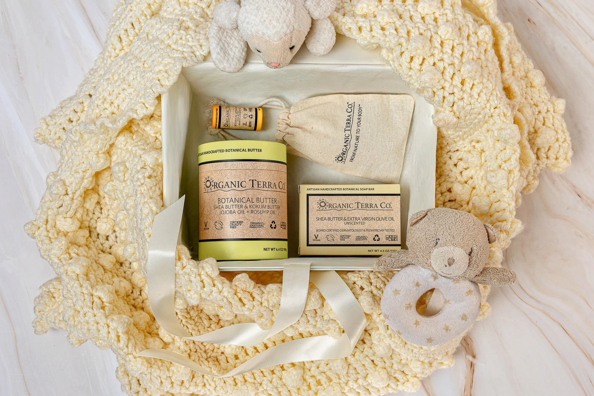 Organic Terra Co. Mama & Baby Collection contents — unscented botanical soap bar, 6.4 oz Botanical Butter, lip balm and lavender sachet