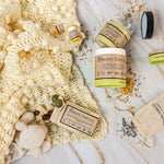 Organic Terra Co. Mama & Baby Collection contents — unscented botanical soap bar, 6.4 oz Botanical Butter, lip balm and lavender sachet