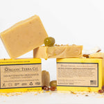 ORGANIC TERRA CO.® Butter Extra Virgin Olive Oil Calendula and Chamomile soap bar front and back packaging showing fair trade ingredients alongside unwrapped bars and dried botanicals