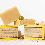 ORGANIC TERRA CO.® Butter Extra Virgin Olive Oil Calendula and Chamomile soap bar front and back packaging showing fair trade ingredients alongside unwrapped bars and dried botanicals