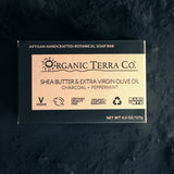 ORGANIC TERRA CO.® Butter Extra Virgin Olive Oil Charcoal and Peppermint soap bar black box on dark textured charcoal stone surface