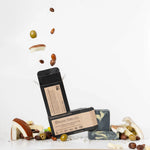 ORGANIC TERRA CO.®Shea Butter Extra
Virgin Olive Oil Charcoal and Peppermint soap bar front and back packaging with unwrapped bars and scattered shea nuts olives and cacao beans
