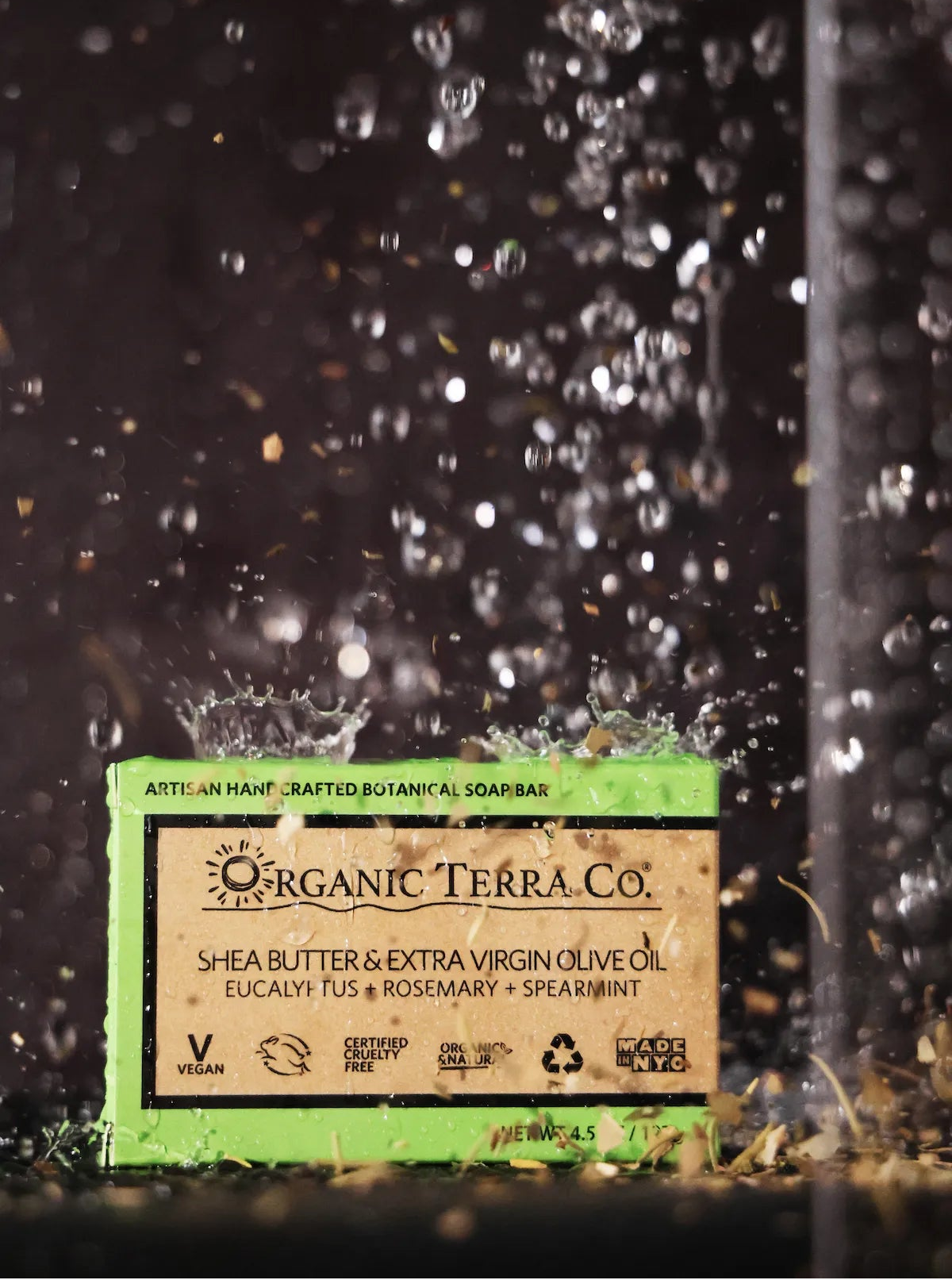 ORGANIC TERRA CO.®Shea Butter Extra Virgin Olive Oil Eucalyptus Rosemary and Spearmint soap bar box with dramatic water splash on dark background