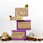 ORGANIC TERRA CO.®Shea Butter Extra
Virgin Olive Oil Lavender soap bar front and back packaging with unwrapped bars and scattered shea nuts olives coconut and lavender buds